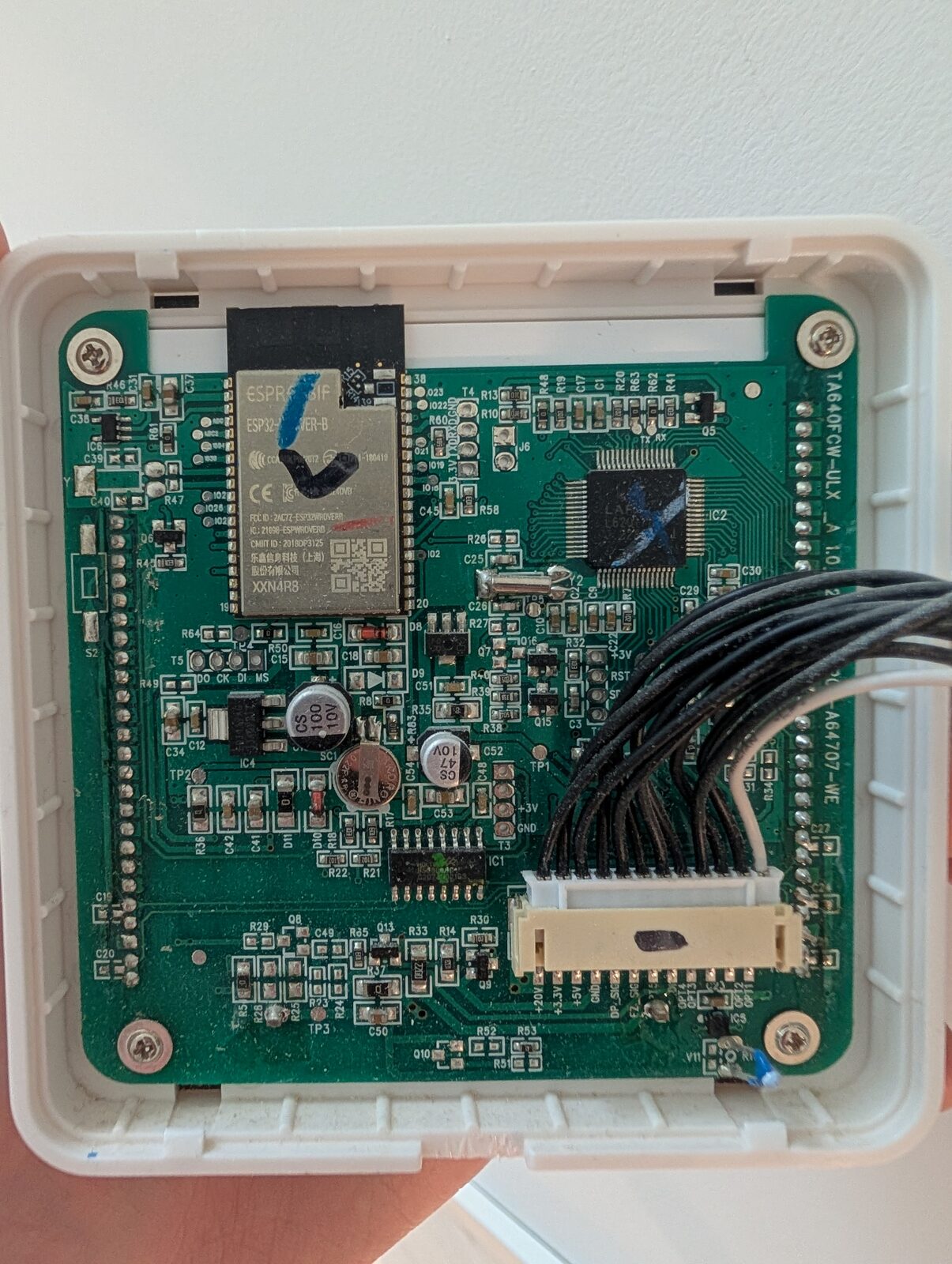 The thermostat's Wi-Fi daughterboard: an ESP32 module on a header.
