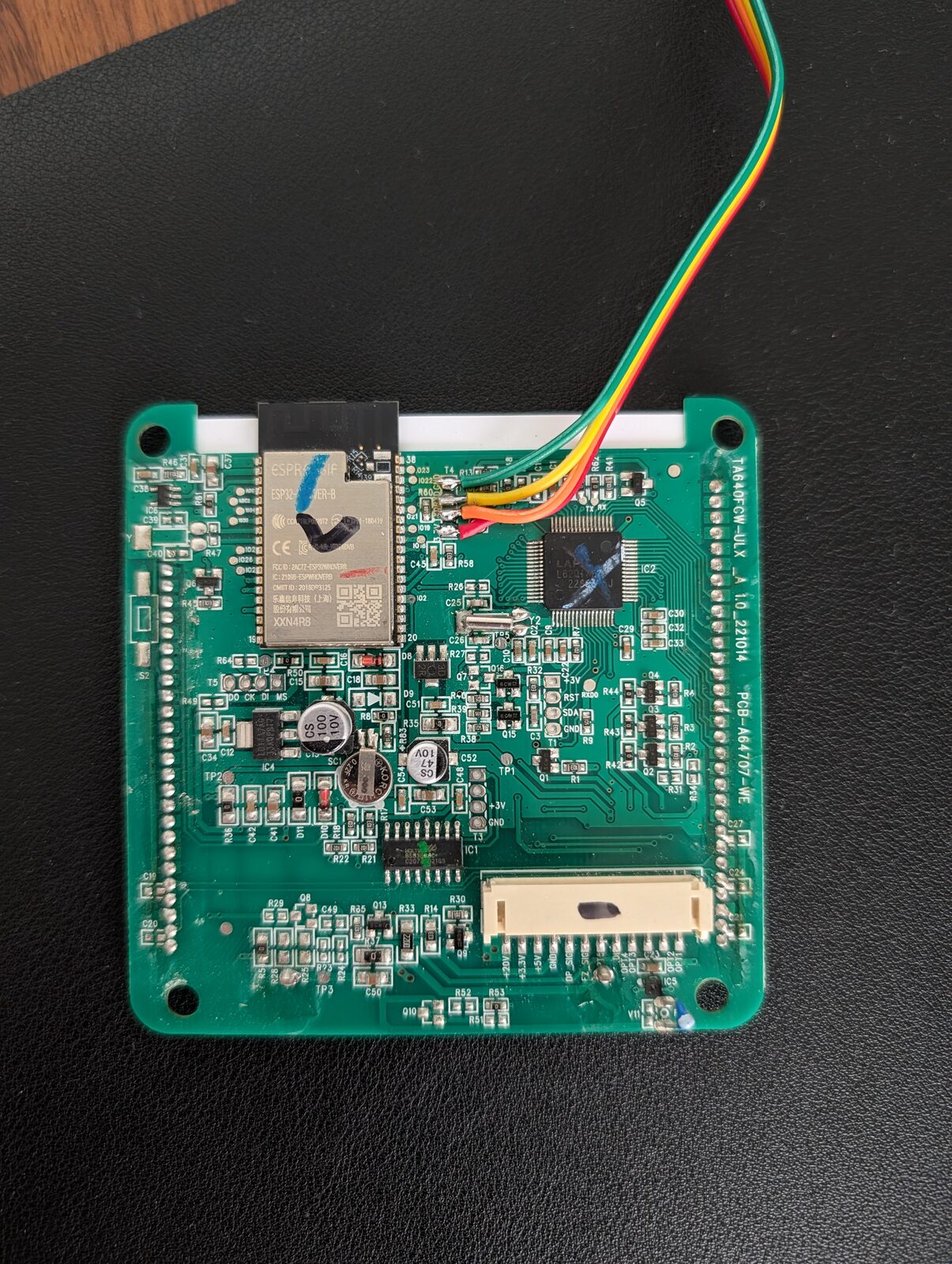 Close-up of four wires soldered to the ESP32 programming pads.